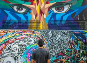 photography of man seeing doddle wall art